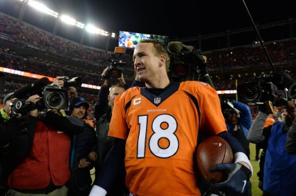 Jan 3, 2016; Denver, CO, USA; Denver Broncos quarterback Peyton Manning (18) celebrates winning following the game against the San Diego Chargers at Sports Authority Field at Mile High. The Broncos defeated the Chargers 27-20. Mandatory Credit: Ron Chenoy-USA TODAY Sports