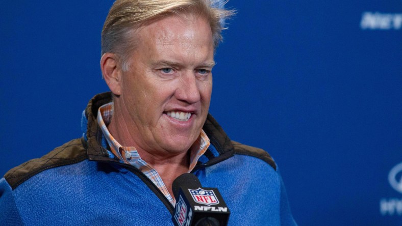 John Elway and the Broncos are looking to move up in the draft