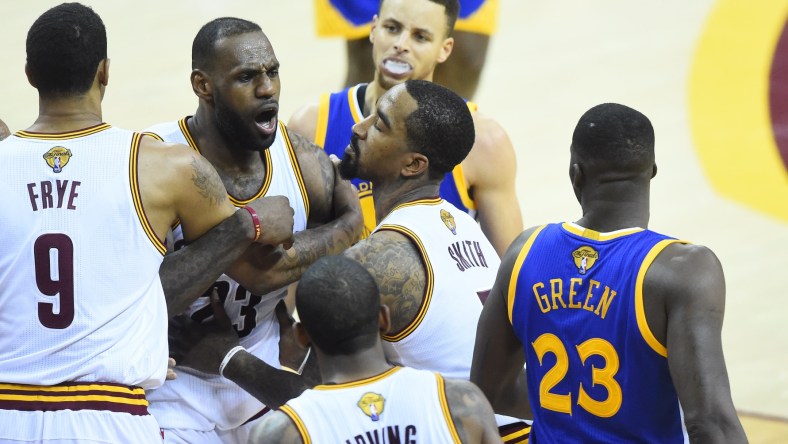 Jun 10, 2016; Cleveland, OH, USA; Cleveland Cavaliers forward LeBron James (23) exchanges words with Golden State Warriors forward Draymond Green (23) during the fourth quarter in game four of the NBA Finals at Quicken Loans Arena. The Warriors won 108-97. Mandatory Credit: David Richard-USA TODAY Sports