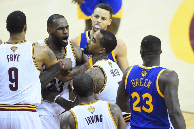 Jun 10, 2016; Cleveland, OH, USA; Cleveland Cavaliers forward LeBron James (23) exchanges words with Golden State Warriors forward Draymond Green (23) during the fourth quarter in game four of the NBA Finals at Quicken Loans Arena. The Warriors won 108-97. Mandatory Credit: David Richard-USA TODAY Sports