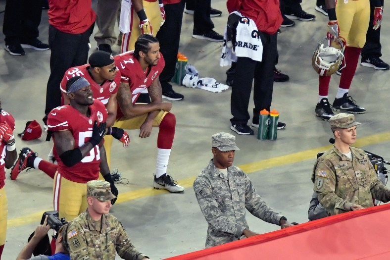 Eric Reid and Colin Kaepernick kneel during the anthem