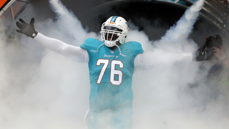 Jan 1, 2017; Miami Gardens, FL, USA; Miami Dolphins offensive tackle Branden Albert (76) is introduced before an NFL football game against the New England Patriots at Hard Rock Stadium. Mandatory Credit: Reinhold Matay-USA TODAY Sports