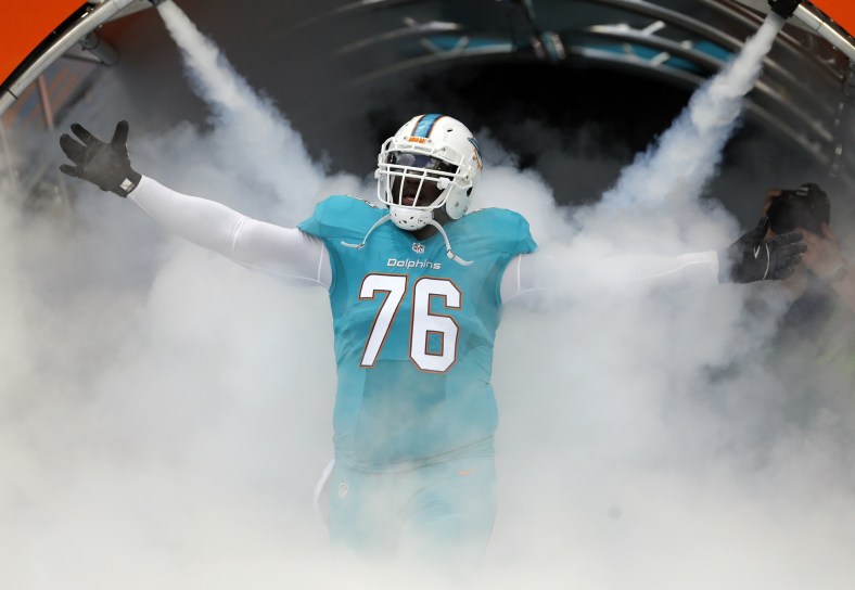 Jan 1, 2017; Miami Gardens, FL, USA; Miami Dolphins offensive tackle Branden Albert (76) is introduced before an NFL football game against the New England Patriots at Hard Rock Stadium. Mandatory Credit: Reinhold Matay-USA TODAY Sports