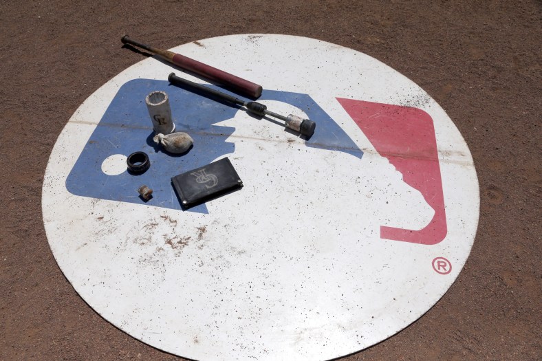 Aug 11, 2016; Arlington, TX, USA; A general view of the MLB logo with Colorado Rockies batting gear on it during the game against the Texas Rangers at Globe Life Park in Arlington. Colorado Rockies won 12-9. Mandatory Credit: Tim Heitman-USA TODAY Sports