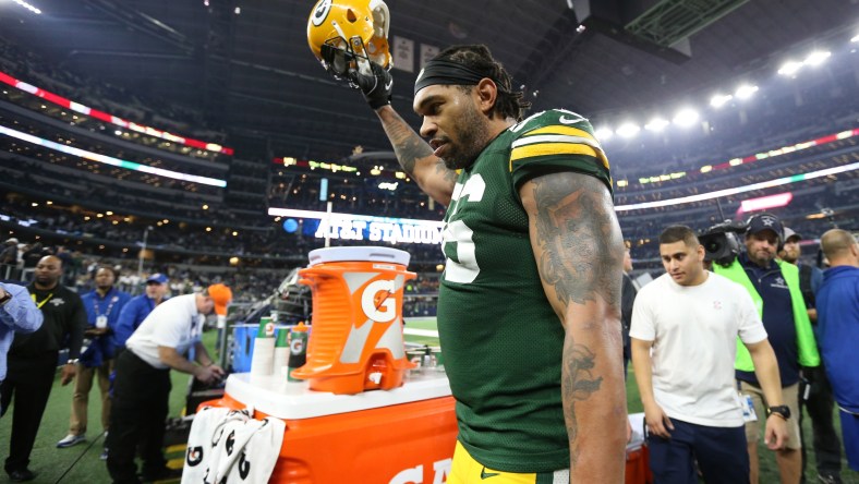 Caption: Jan 15, 2017; Arlington, TX, USA; Green Bay Packers linebacker Julius Peppers (56) celebrates a victory against the Dallas Cowboys in the NFC Divisional playoff game at AT&T Stadium. Mandatory Credit: Matthew Emmons-USA TODAY Sports