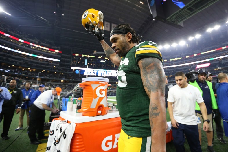 Caption: Jan 15, 2017; Arlington, TX, USA; Green Bay Packers linebacker Julius Peppers (56) celebrates a victory against the Dallas Cowboys in the NFC Divisional playoff game at AT&T Stadium. Mandatory Credit: Matthew Emmons-USA TODAY Sports