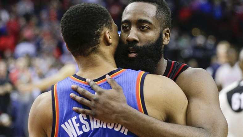 Jan 5, 2017; Houston, TX, USA; Houston Rockets guard James Harden (13) hugs Oklahoma City Thunder guard Russell Westbrook (0) after the Rockets defeated the City Thunder at Toyota Center. Houston Rockets won 118 to 116. Mandatory Credit: Thomas B. Shea-USA TODAY Sports