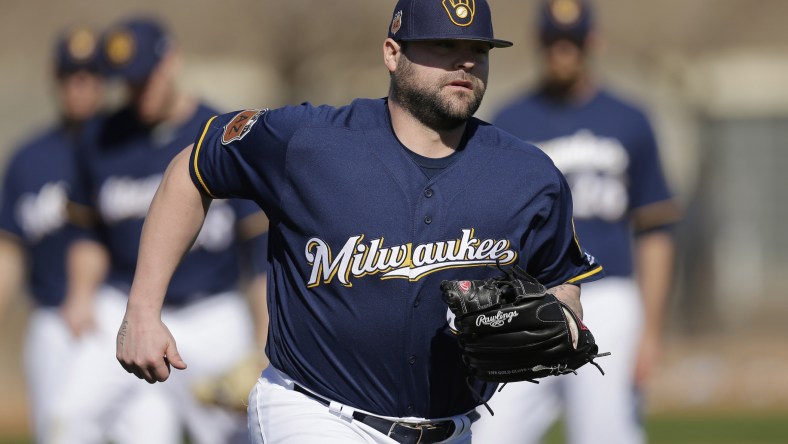 Feb 16, 2017; Maryvale, AZ, USA; Milwaukee Brewers relief pitcher Joba Chamberlain (62) covers first base during spring training camp drills at Maryvale Baseball Park. Mandatory Credit: Rick Scuteri-USA TODAY Sports