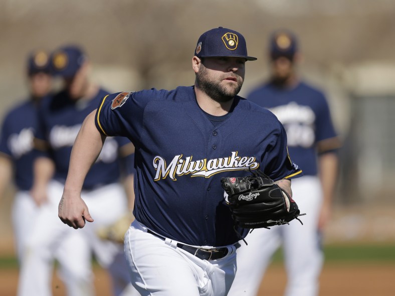 Feb 16, 2017; Maryvale, AZ, USA; Milwaukee Brewers relief pitcher Joba Chamberlain (62) covers first base during spring training camp drills at Maryvale Baseball Park. Mandatory Credit: Rick Scuteri-USA TODAY Sports