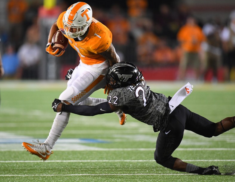 Caption: Sep 10, 2016; Bristol, TN, USA; Tennessee Volunteers running back Jalen Hurd (1) runs for a short gain while being tackled by Virginia Tech Hokies defensive back Terrell Edmunds (22) during the first half at Bristol Motor Speedway. Mandatory Credit: Christopher Hanewinckel-USA TODAY Sports Created: