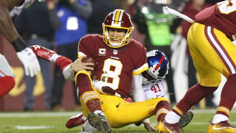 Caption: Jan 1, 2017; Landover, MD, USA; Washington Redskins quarterback Kirk Cousins (8) is sacked by New York Giants cornerback Dominique Rodgers-Cromartie (41) in the second quarter at FedEx Field. Mandatory Credit: Geoff Burke-USA TODAY Sports