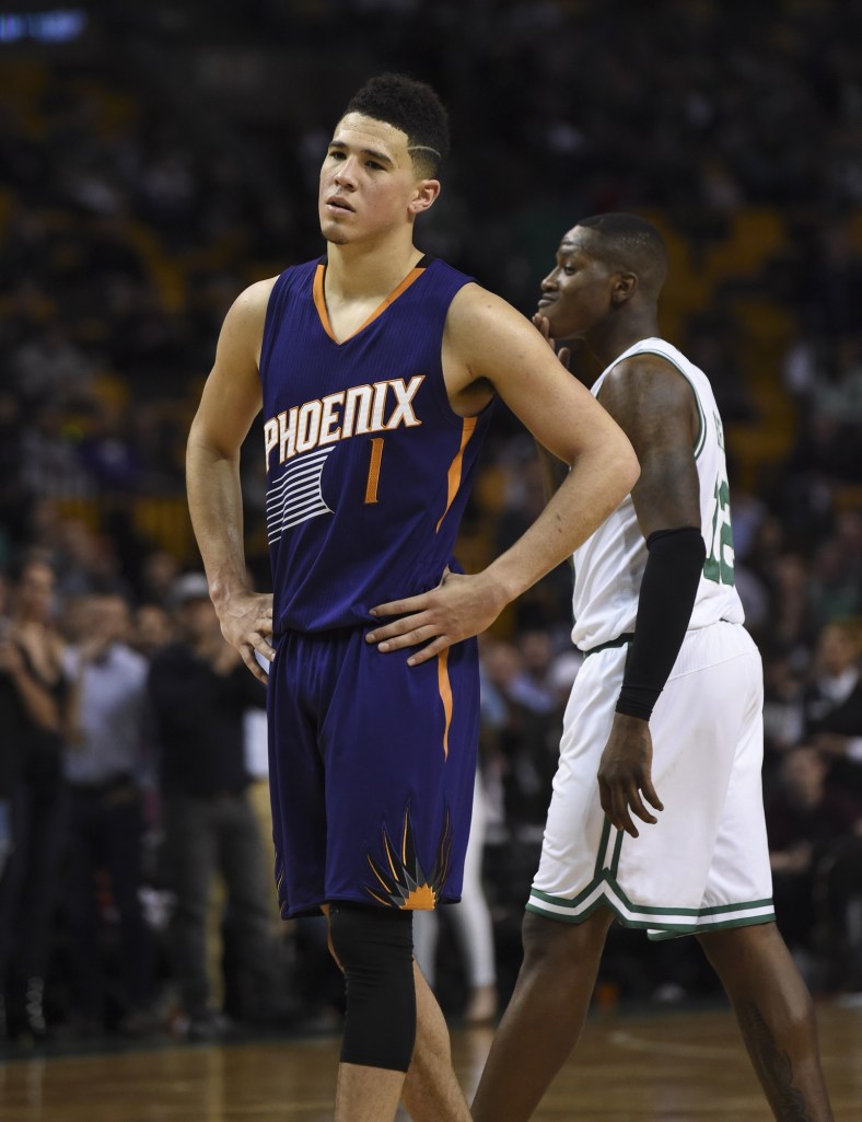Caption: Mar 24, 2017; Boston, MA, USA; Phoenix Suns guard Devin Booker (1) during the second half against the Boston Celtics at TD Garden. Mandatory Credit: Bob DeChiara-USA TODAY Sports