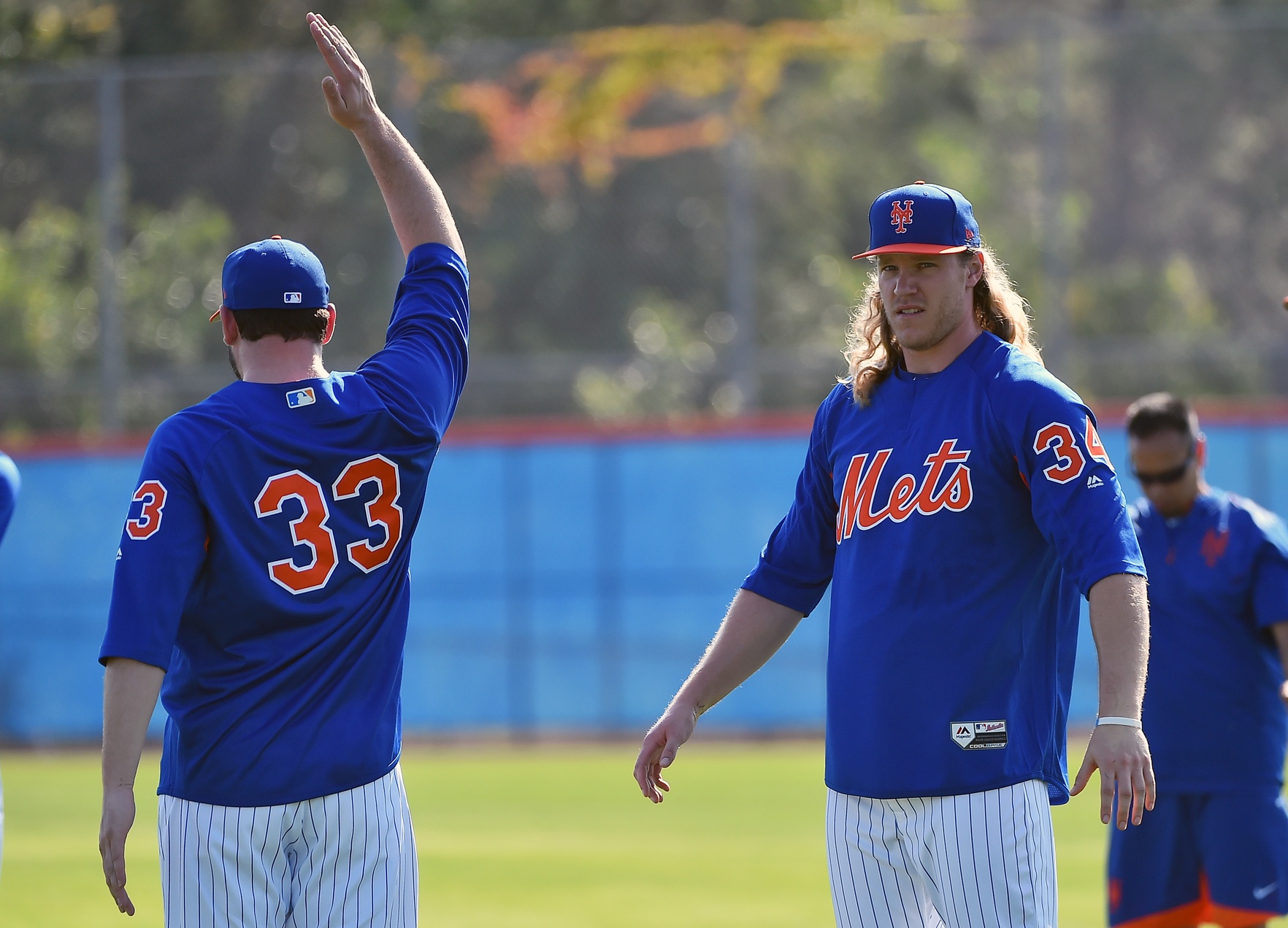 Feb 14, 2017; Port St. Lucie, FL, USA; New York Mets starting pitcher Matt Harvey (33) and starting pitcher Noah Syndergaard (34) stretch during spring training workouts at Tradition Field. Mandatory Credit: Jasen Vinlove-USA TODAY Sports