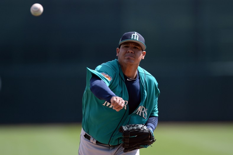 Feb 28, 2017; Phoenix, AZ, USA; Seattle Mariners starting pitcher Felix Hernandez (34) pitches in the first inning against the Chicago White Sox at Camelback Ranch. Mandatory Credit: