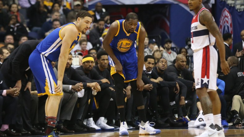 Feb 28, 2017; Washington, DC, USA; Golden State Warriors forward Kevin Durant (35) holds his knee after being injured against the Washington Wizards in the first quarter at Verizon Center. Mandatory Credit: Geoff Burke-USA TODAY Sports