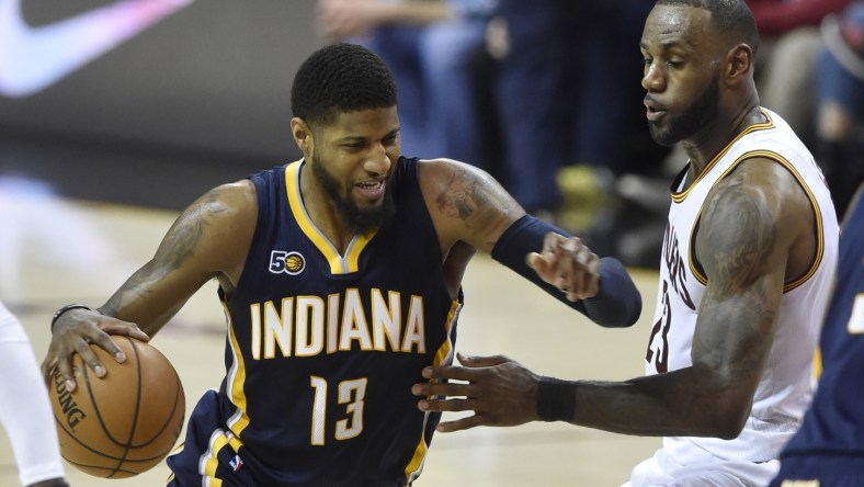 Caption: Apr 2, 2017; Cleveland, OH, USA; Indiana Pacers forward Paul George (13) drives against Cleveland Cavaliers forward LeBron James (23) in the second quarter at Quicken Loans Arena. Mandatory Credit: David Richard-USA TODAY Sports