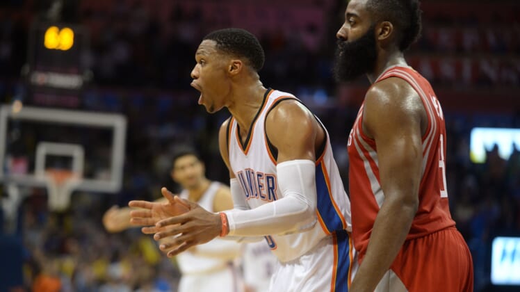 Caption: Nov 16, 2016; Oklahoma City, OK, USA; Oklahoma City Thunder guard Russell Westbrook (0) and Houston Rockets guard James Harden (13) react after a play against the Houston Rockets during the fourth quarter at Chesapeake Energy Arena. Mandatory Credit: Mark D. Smith-USA TODAY Sports