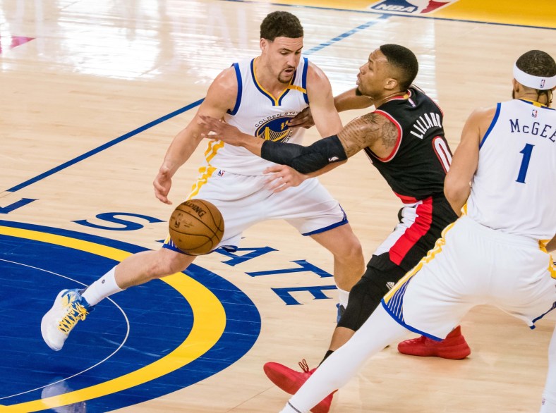 Caption: Apr 19, 2017; Oakland, CA, USA; Golden State Warriors guard Klay Thompson (11) against Portland Trail Blazers guard Damian Lillard (0) during the first quarter in game two of the first round of the 2017 NBA Playoffs at Oracle Arena. Mandatory Credit: Kelley L Cox-USA TODAY Sports