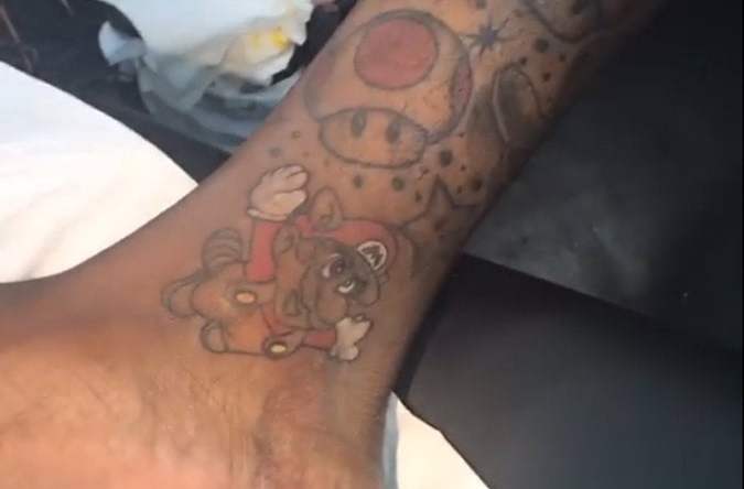 Check out John Wall's new Mario Brothers tattoo.