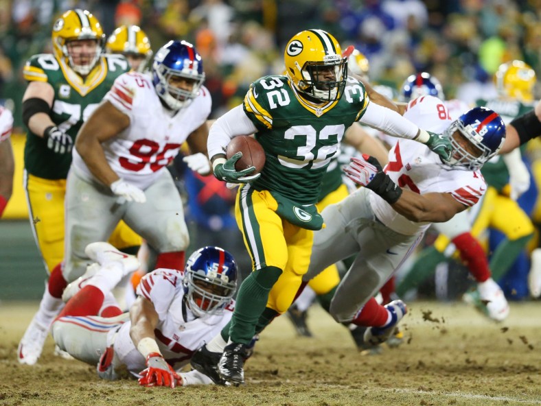 Jan 8, 2017; Green Bay, WI, USA; Green Bay Packers running back Christine Michael (32) stiff arms New York Giants defensive end Romeo Okwara (78) during the third quarter in the NFC Wild Card playoff football game at Lambea