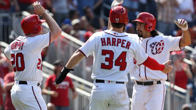 Caption: Apr 30, 2017; Washington, DC, USA; Washington Nationals third baseman Anthony Rendon (6) celebrates with Nationals second baseman Daniel Murphy (20) and Nationals right fielder Bryce Harper (34) after hitting a three-run home run against the New York Mets in the fourth inning at Nationals Park. Mandatory Credit: Geoff Burke-USA TODAY Sports