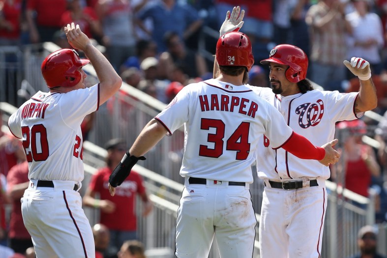 Caption: Apr 30, 2017; Washington, DC, USA; Washington Nationals third baseman Anthony Rendon (6) celebrates with Nationals second baseman Daniel Murphy (20) and Nationals right fielder Bryce Harper (34) after hitting a three-run home run against the New York Mets in the fourth inning at Nationals Park. Mandatory Credit: Geoff Burke-USA TODAY Sports