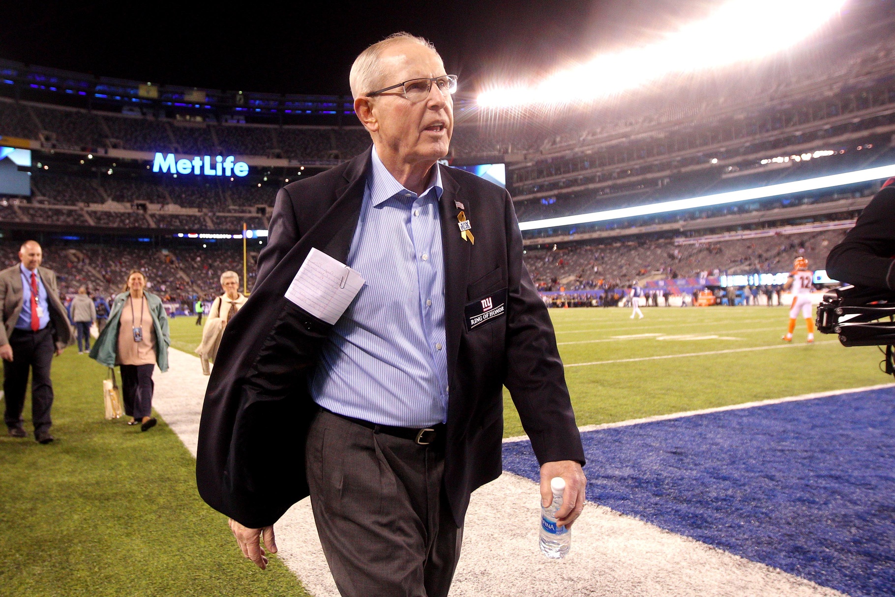 Nov 14, 2016; East Rutherford, NJ, USA; New York Giants former head coach Tom Coughlin walks off the field after being interviewed before a game between the New York Giants and the Cincinnati Bengals at MetLife Stadium. The Giants will induct Coughlin into their Ring of Honor during a halftime ceremony. Mandatory Credit: Brad Penner-USA TODAY Sports