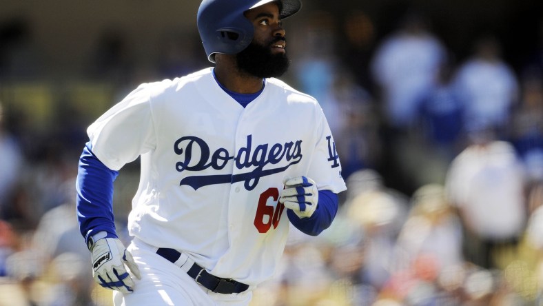 Caption: April 30, 2017; Los Angeles, CA, USA; Los Angeles Dodgers center fielder Andrew Toles (60) runs after he hits a three run home run in the sixth inning against the Philadelphia Phillies at Dodger Stadium. Mandatory Credit: Gary A. Vasquez-USA TODAY Sports