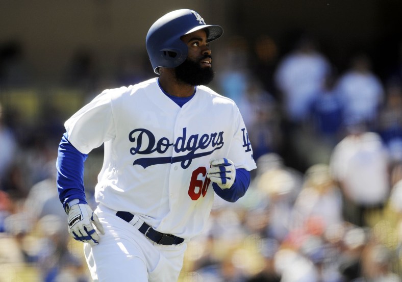 Caption: April 30, 2017; Los Angeles, CA, USA; Los Angeles Dodgers center fielder Andrew Toles (60) runs after he hits a three run home run in the sixth inning against the Philadelphia Phillies at Dodger Stadium. Mandatory Credit: Gary A. Vasquez-USA TODAY Sports