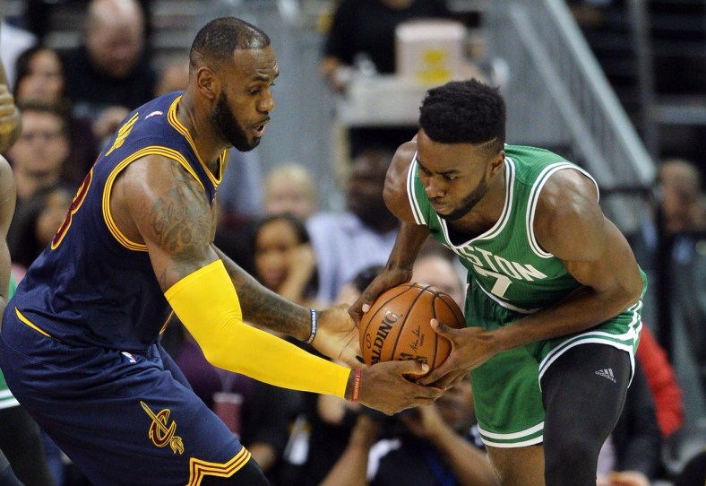 Caption: Nov 3, 2016; Cleveland, OH, USA; Cleveland Cavaliers forward LeBron James (23) fights for the ball with Boston Celtics forward Jaylen Brown (7) during the first quarter at Quicken Loans Arena. Mandatory Credit: Ken Blaze-USA TODAY Sports