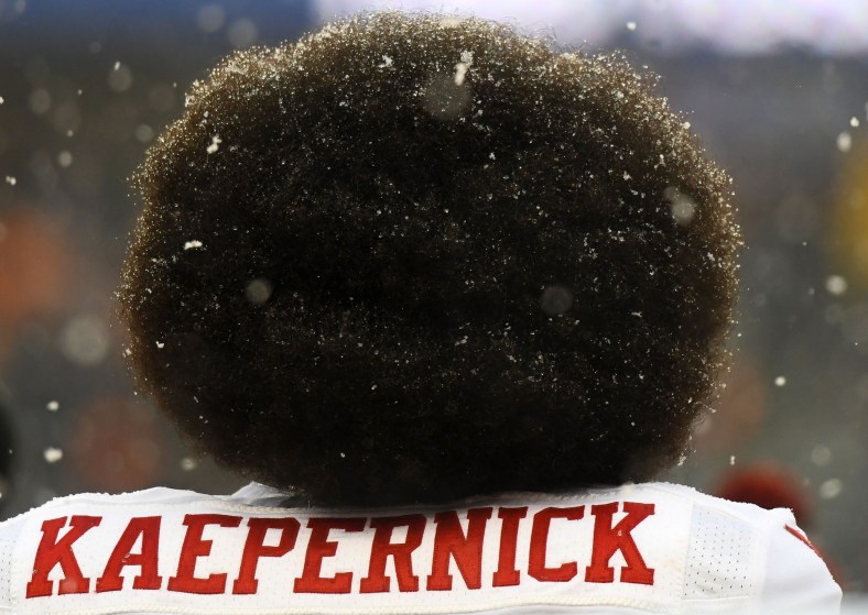 Colin Kaepernick in Chicago as his beautiful hairdo gets snowed upon