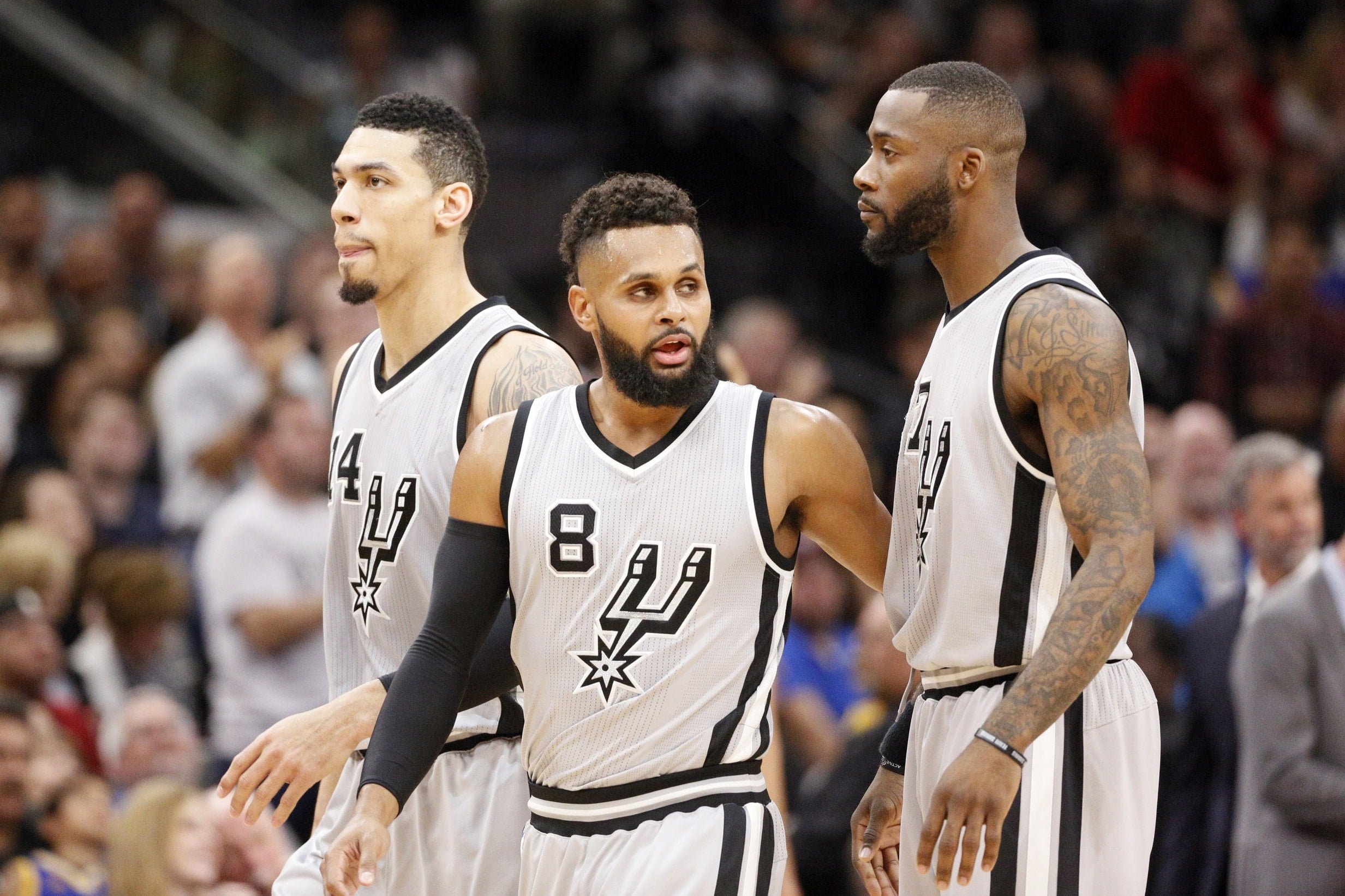 Mar 11, 2017; San Antonio, TX, USA; San Antonio Spurs point guard Patty Mills (8) is congratulated by teammates after a basket during the first half against the Golden State Warriors at AT&T Center. Mandatory Credit: Soobum Im-USA TODAY Sports