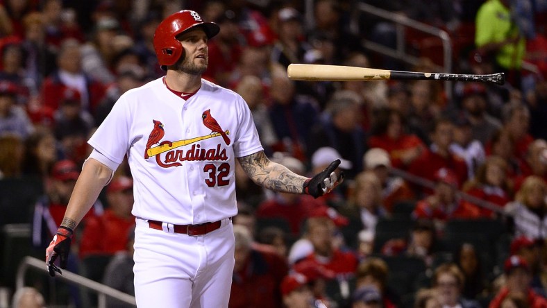 Apr 7, 2017; St. Louis, MO, USA; St. Louis Cardinals first baseman Matt Adams (32) flips his bat after striking out against Cincinnati Reds relief pitcher Raisel Iglesias (not pictured) during the eighth inning at Busch Stadium. The Reds won 2-0. Mandatory Credit: Jeff Curry-USA TODAY Sports