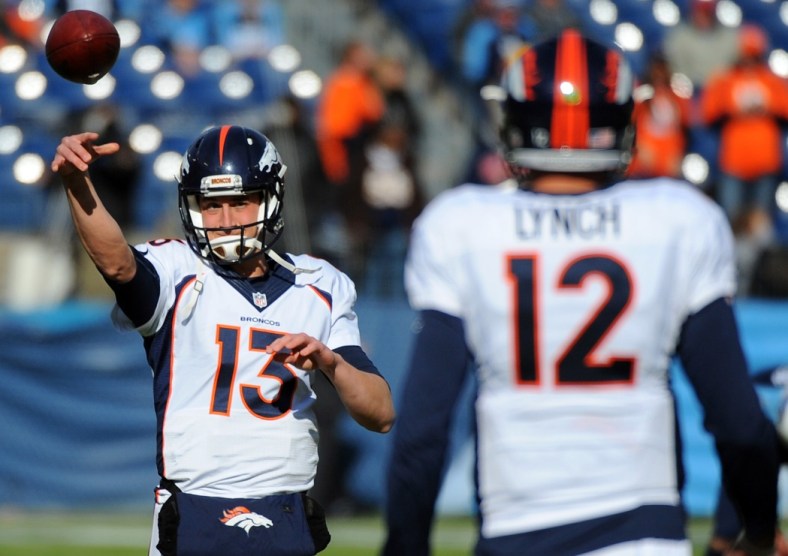 Paxton Lynch and Trevor Siemian warming up before a Broncos game