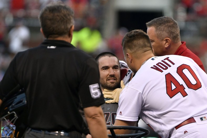 Diamondbacks pitcher Robbie Ray is head in the head by a line drive.