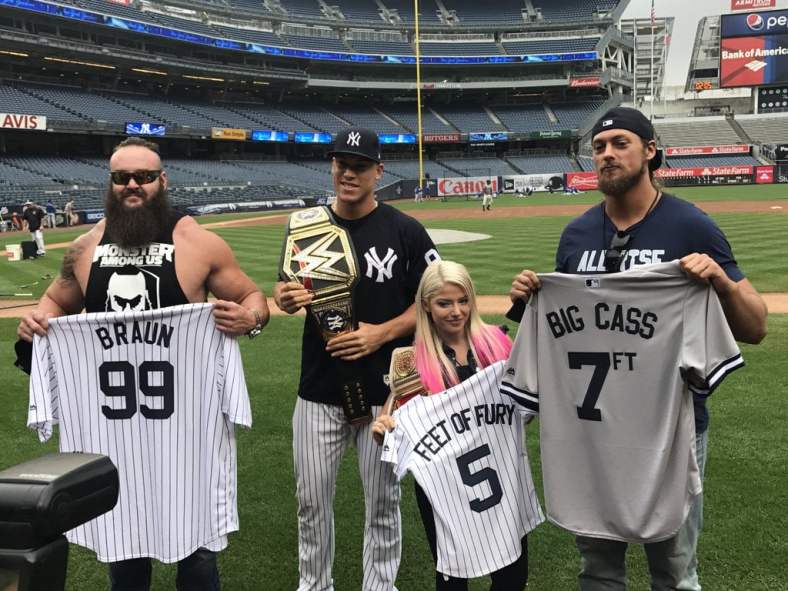 Aaron Judge receives championship belt from these WWE superstars.
