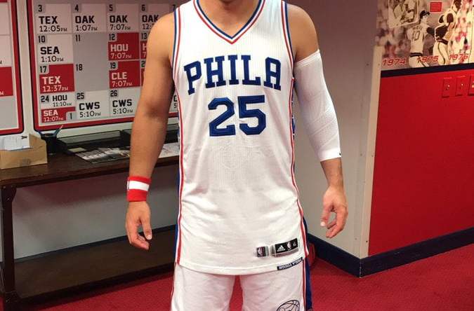 Here is Mike Trout wearing a full Sixers get-up.