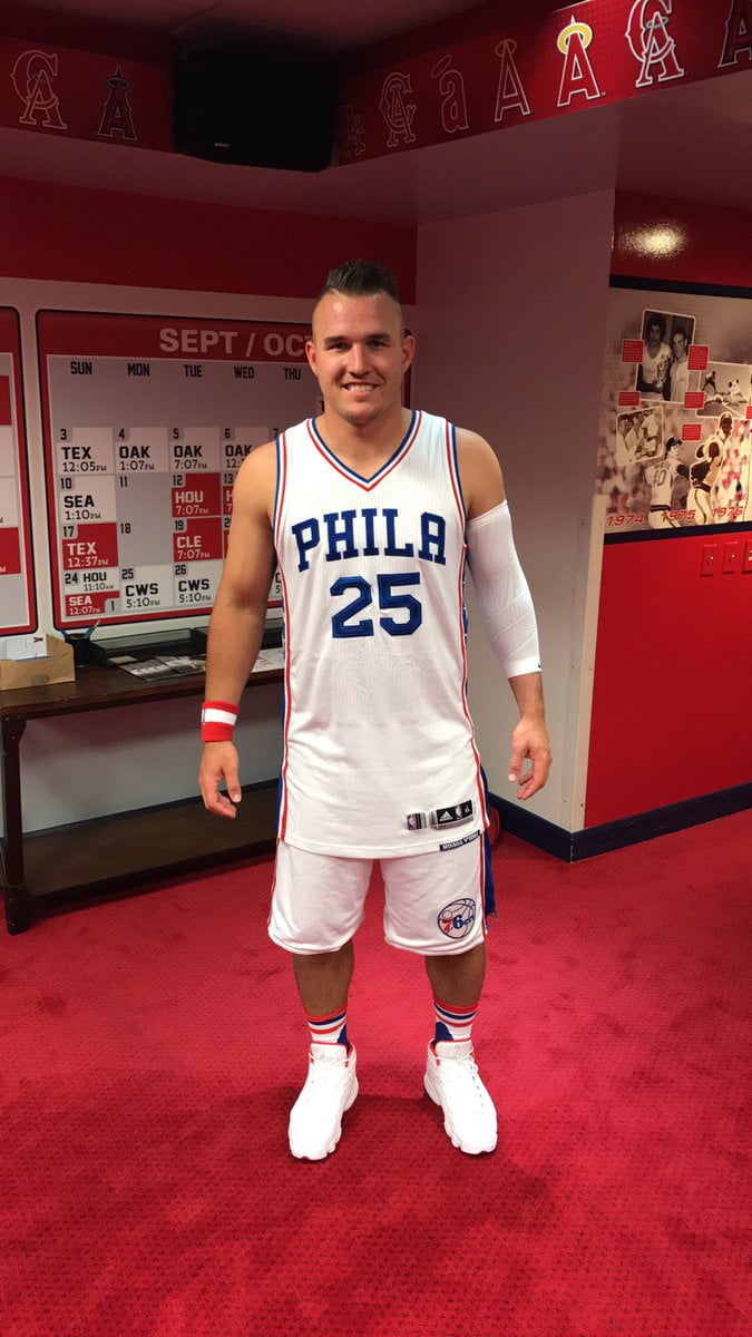 Here is Mike Trout wearing a full Sixers get-up.