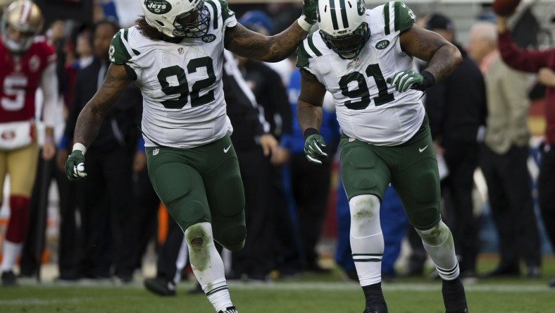 Jets Leonard Williams celebrates with defensive end Sheldon Richardson