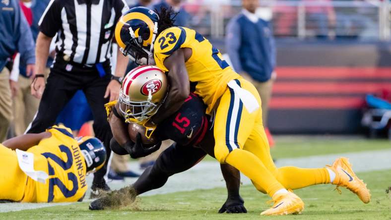 Nickell Robey-Coleman tackles Pierre Garcon