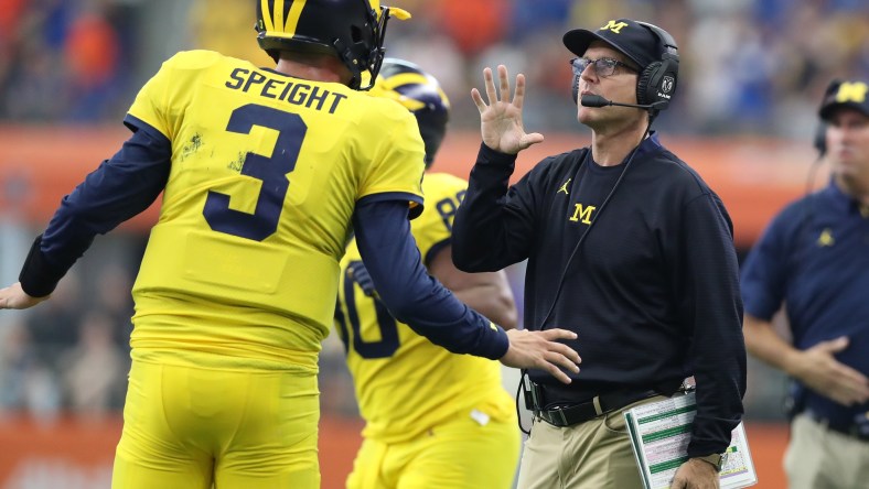 Michigan Quarterback Wilton Speight and head coach Jim Harbaugh