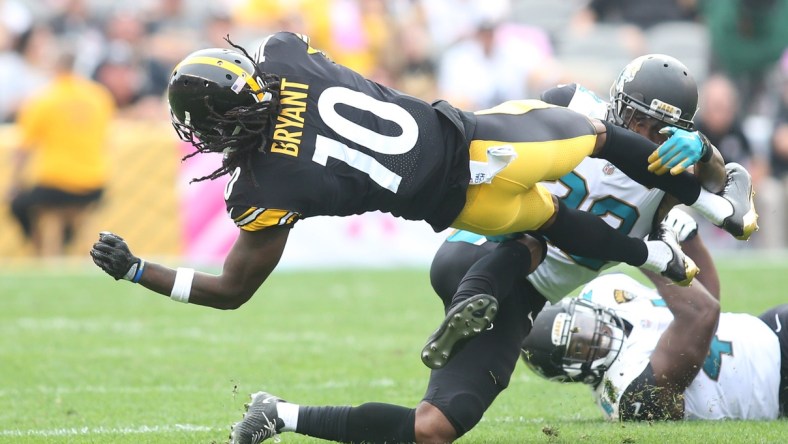 Pittsburgh Steelers wide receiver Martavis Bryant (10) is tackled after a catch by Jacksonville Jaguars cornerback Aaron Colvin (22) during the second quarter at Heinz Field. Jacksonville won 30-9.