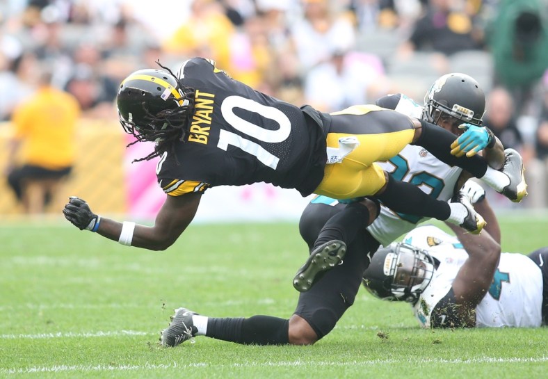 Pittsburgh Steelers wide receiver Martavis Bryant (10) is tackled after a catch by Jacksonville Jaguars cornerback Aaron Colvin (22) during the second quarter at Heinz Field. Jacksonville won 30-9.