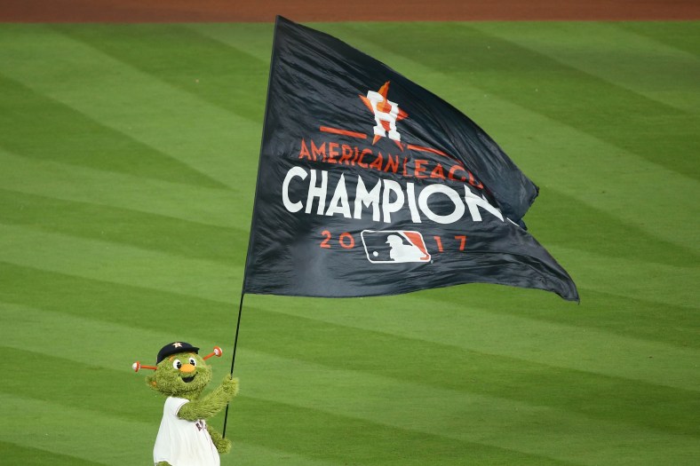 Houston Astros mascot Orbit waives flag after ALCS Game 7