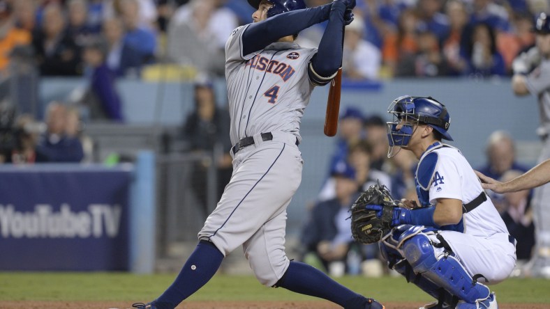 Houston Astros center fielder George Springer hits a solo home run against the Los Angeles Dodgers in the third inning in game six of the 2017 World Series at Dodger Stadium.