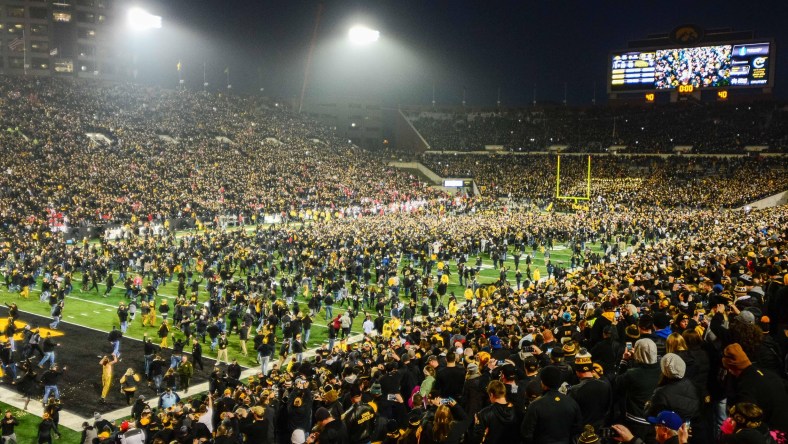 Iowa fans charge the field after the Hawkeyes beat Ohio State in college football Week 10