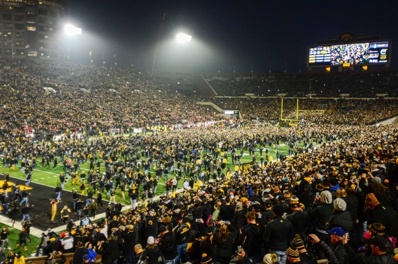 Iowa fans charge the field after the Hawkeyes beat Ohio State in college football Week 10