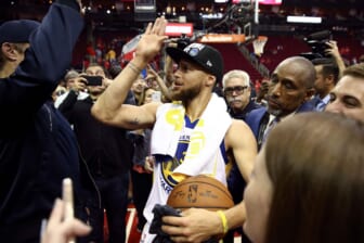 May 28, 2018; Houston, TX, USA; Golden State Warriors guard Stephen Curry (30) high fives a fan after defeating the Houston Rockets in game seven of the Western conference finals of the 2018 NBA Playoffs at Toyota Center. Mandatory Credit: Troy Taormina-USA TODAY Sports