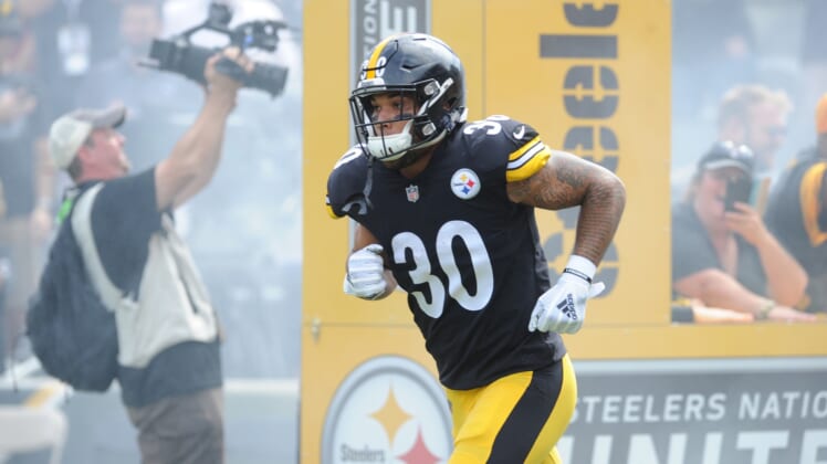Pittsburgh Steelers running back James Conner runs onto the field