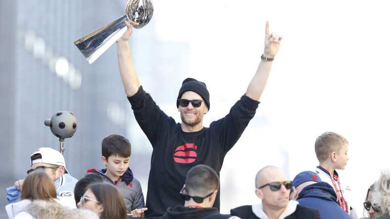 Tom Brady holds the Lombardi Trophy